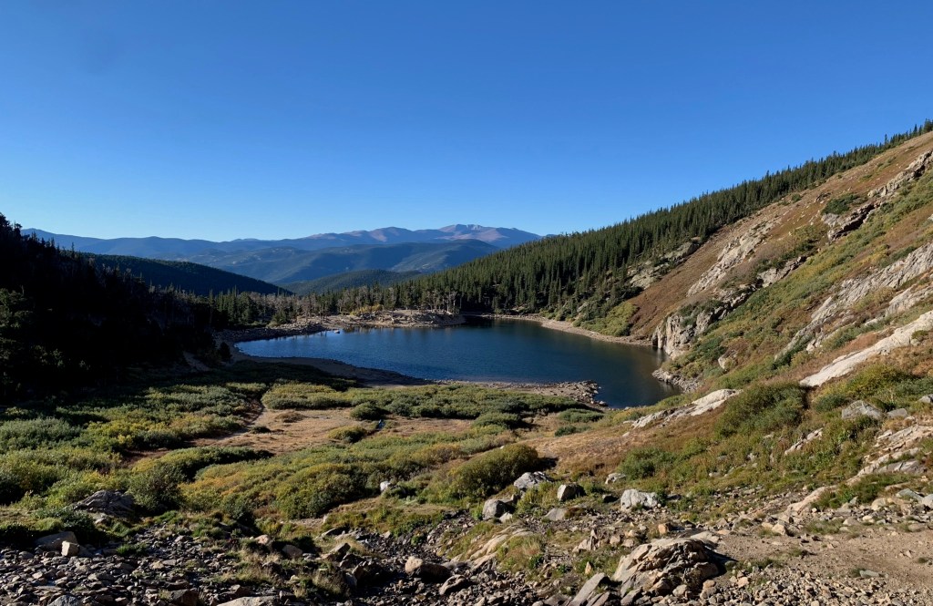 St. Mary's Glacier - Clear Creek County, Colorado - view of alpine lake from standing by glacier above the lake
